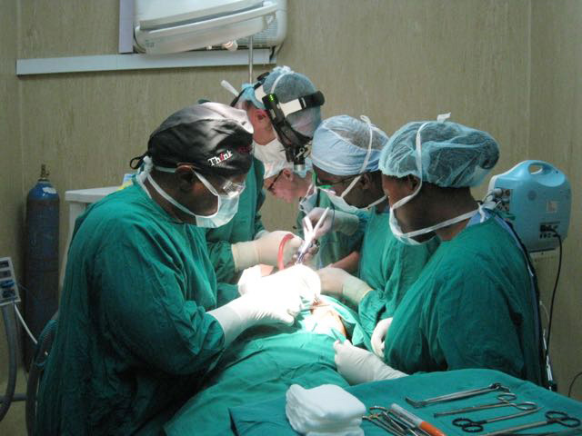 As part of FSS effort to build surgical capacity in Africa, Drs Boahene and Gassner have teamed up. Here the get ready to perform a gracilis flap to restore smile in a patient born with no smile muscles